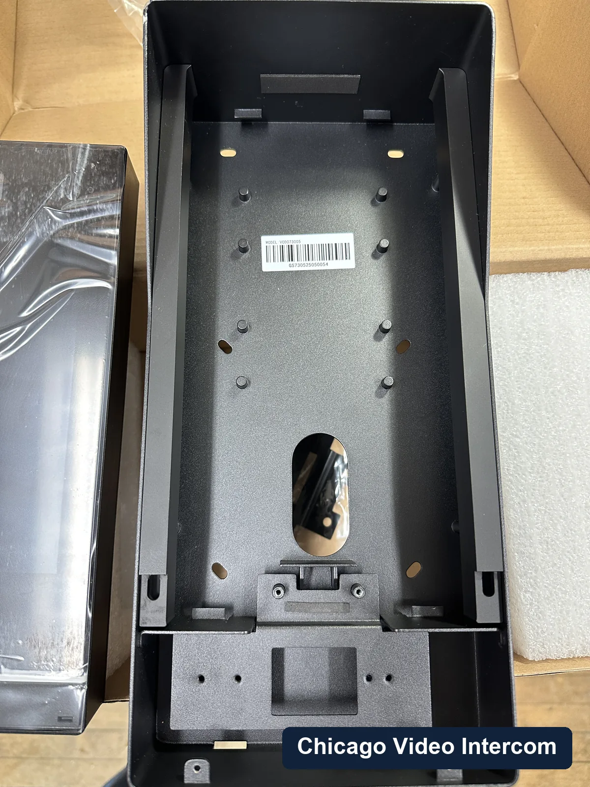 Open 2N-style intercom backbox showing wiring at a Chicago entry