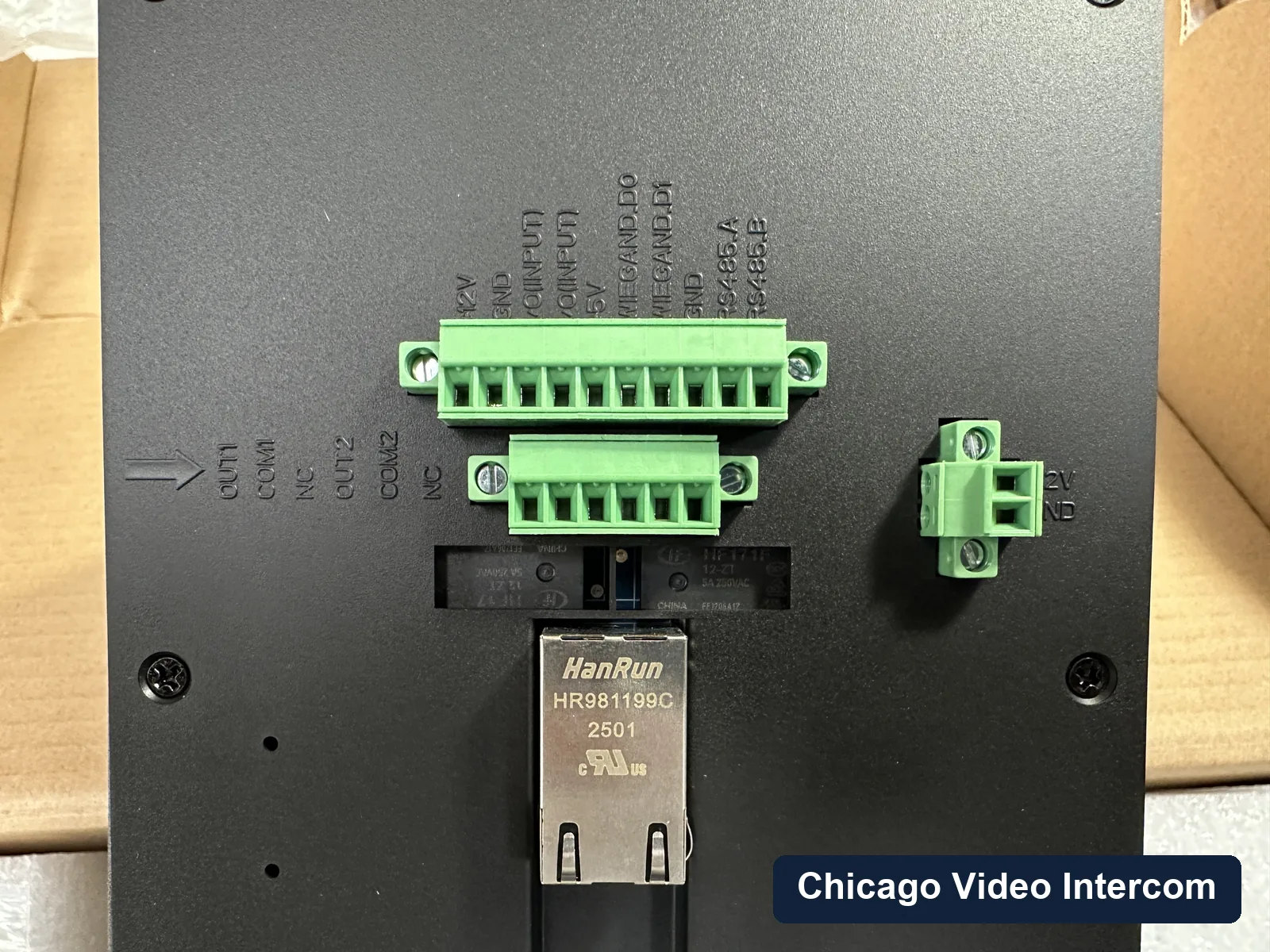 Close-up of IP intercom terminal wiring and control board