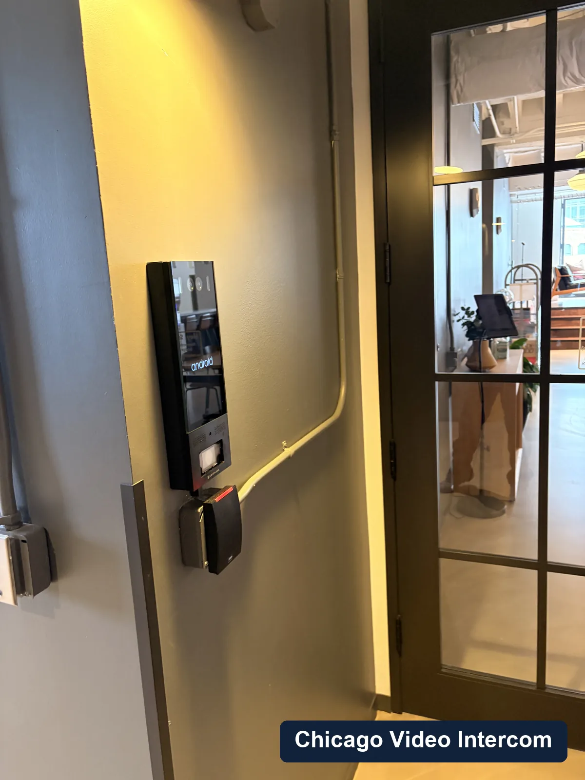 Wall-mounted lobby video intercom screen in a Chicago building