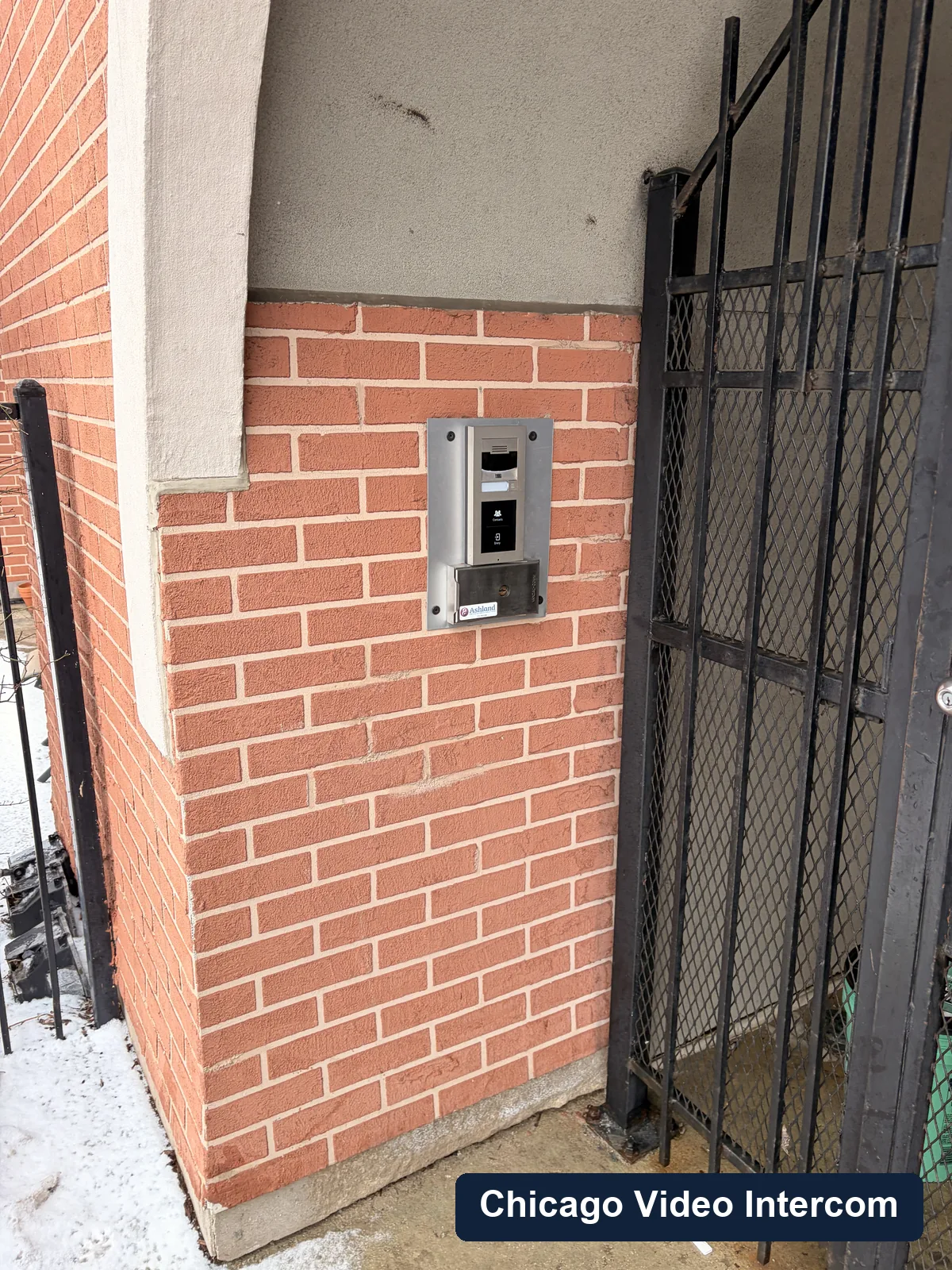 Keypad reader and intercom hardware at a brick Chicago entry