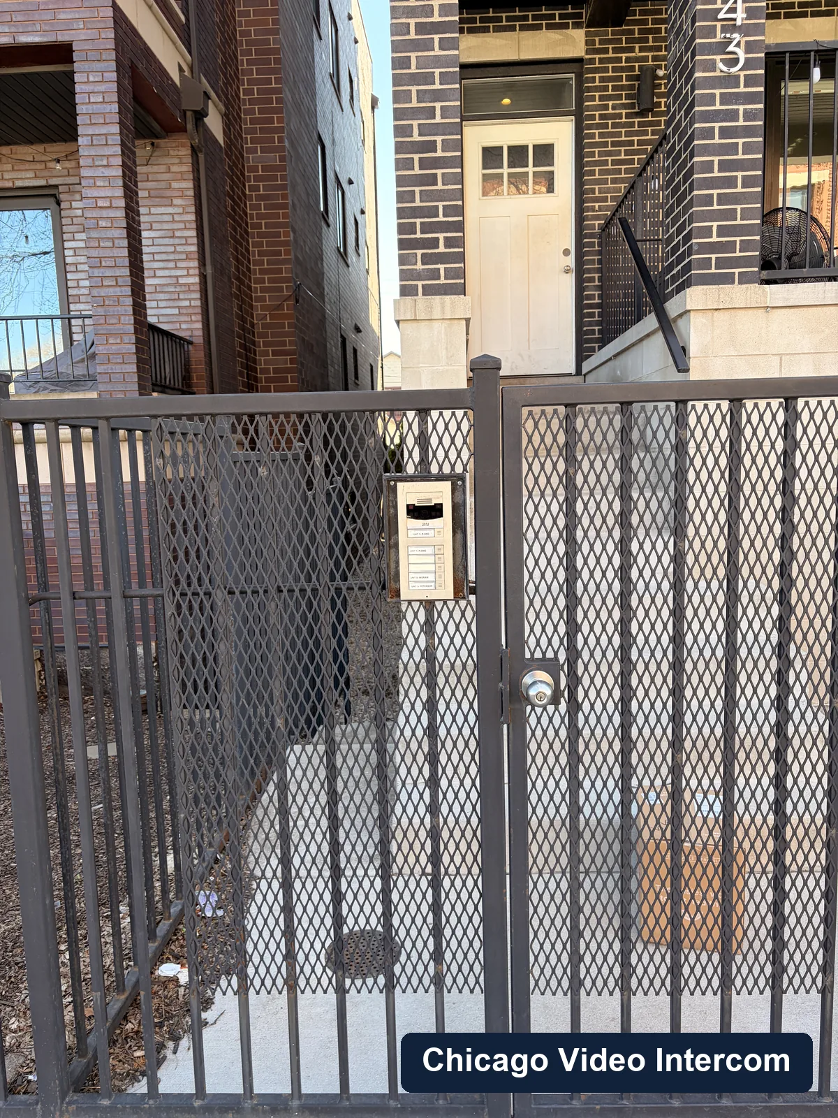 Courtyard gate intercom panel at a Chicago apartment building