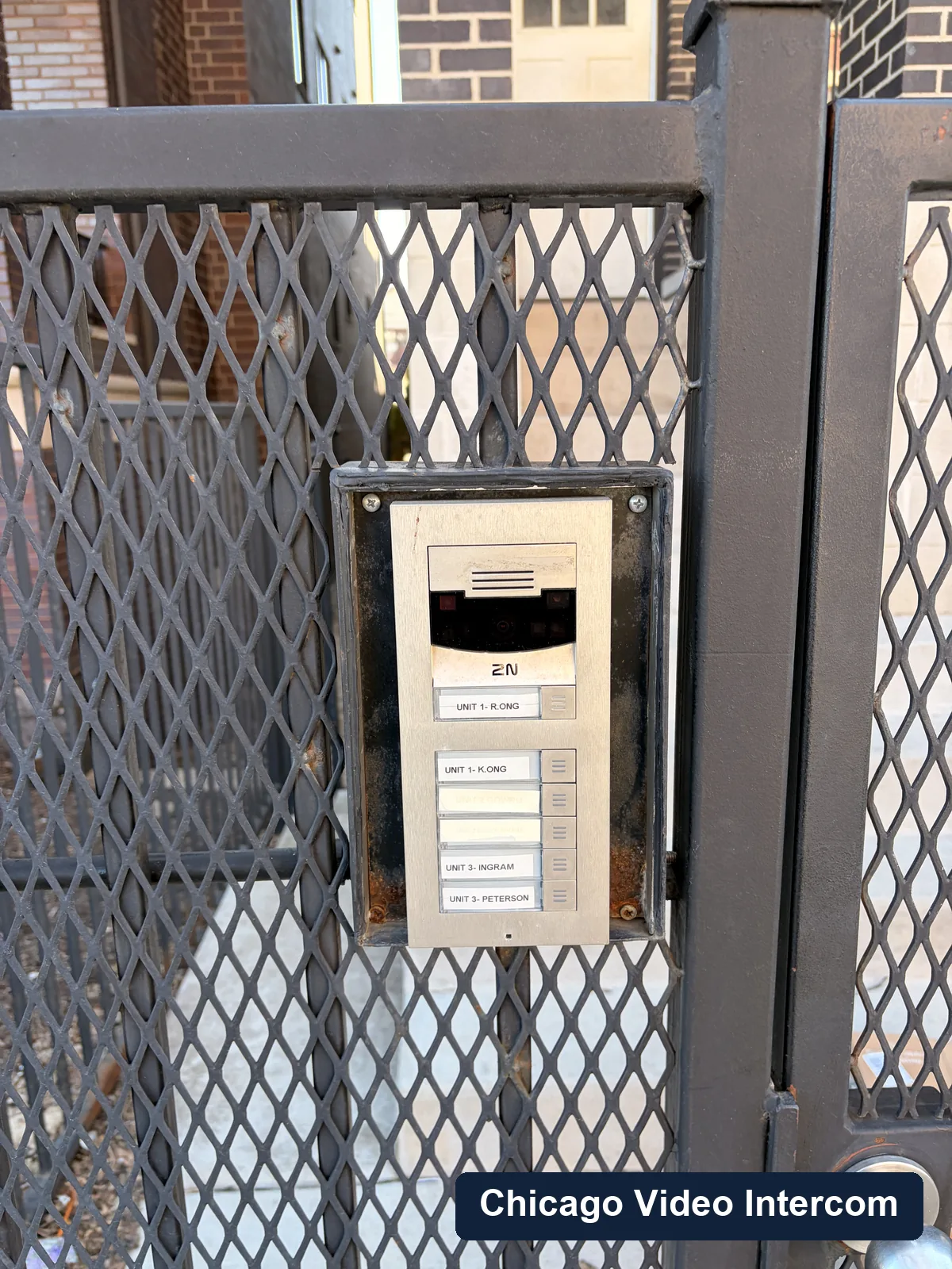 Gated courtyard entry with intercom hardware in Chicago