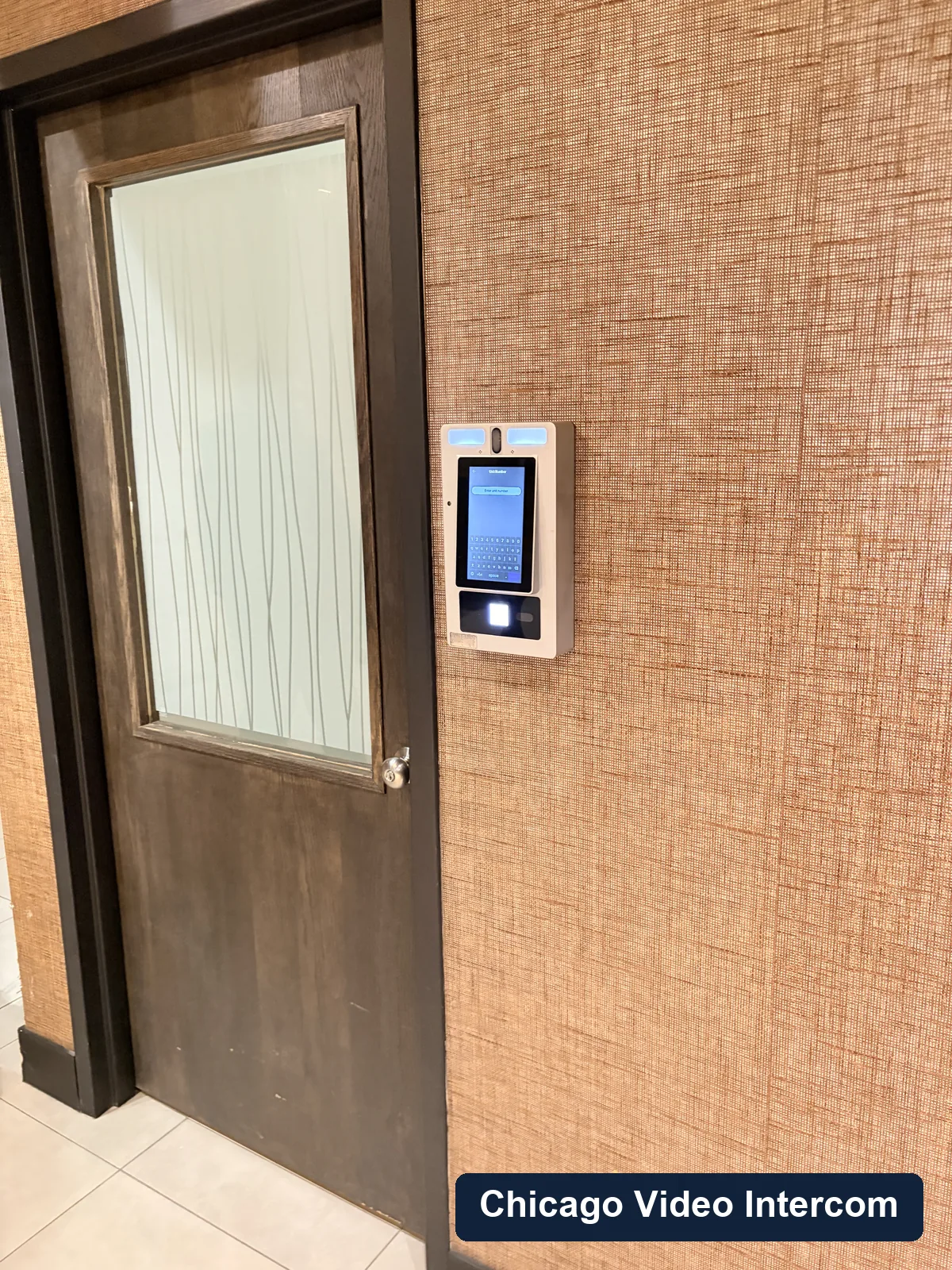 Building lobby video entry panel mounted near a Chicago door