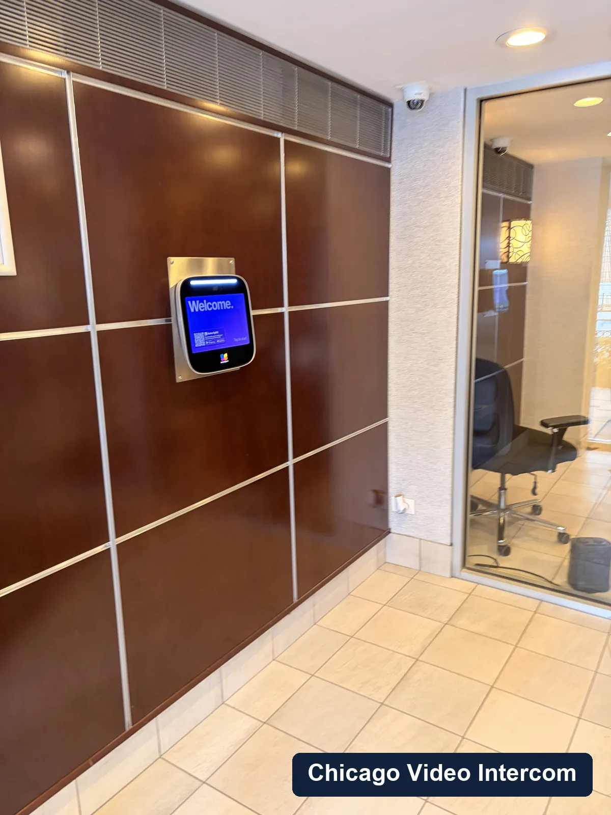 Lobby video entry screen mounted on a wall in Chicago