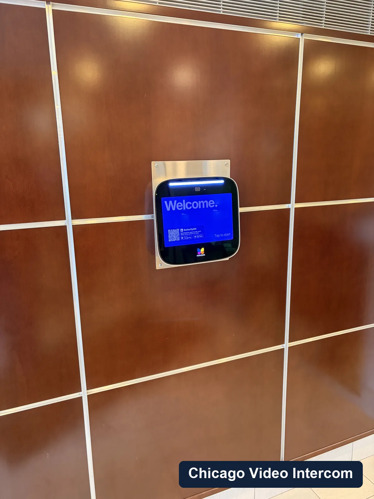 Wall-mounted lobby video intercom panel in a Chicago building